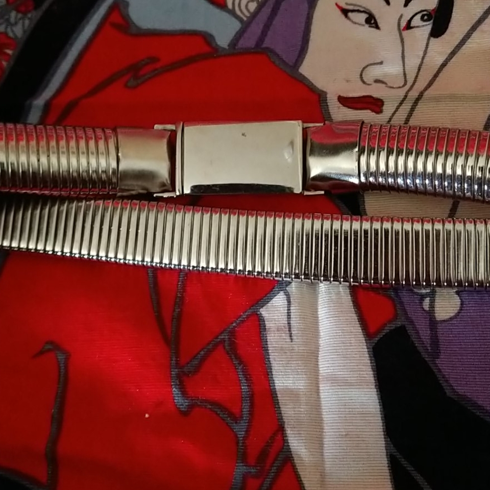 Vintage silver clip into itself belt